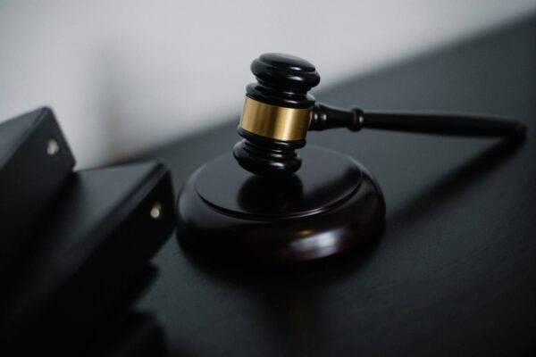 a bailiff's hammer on a table with files